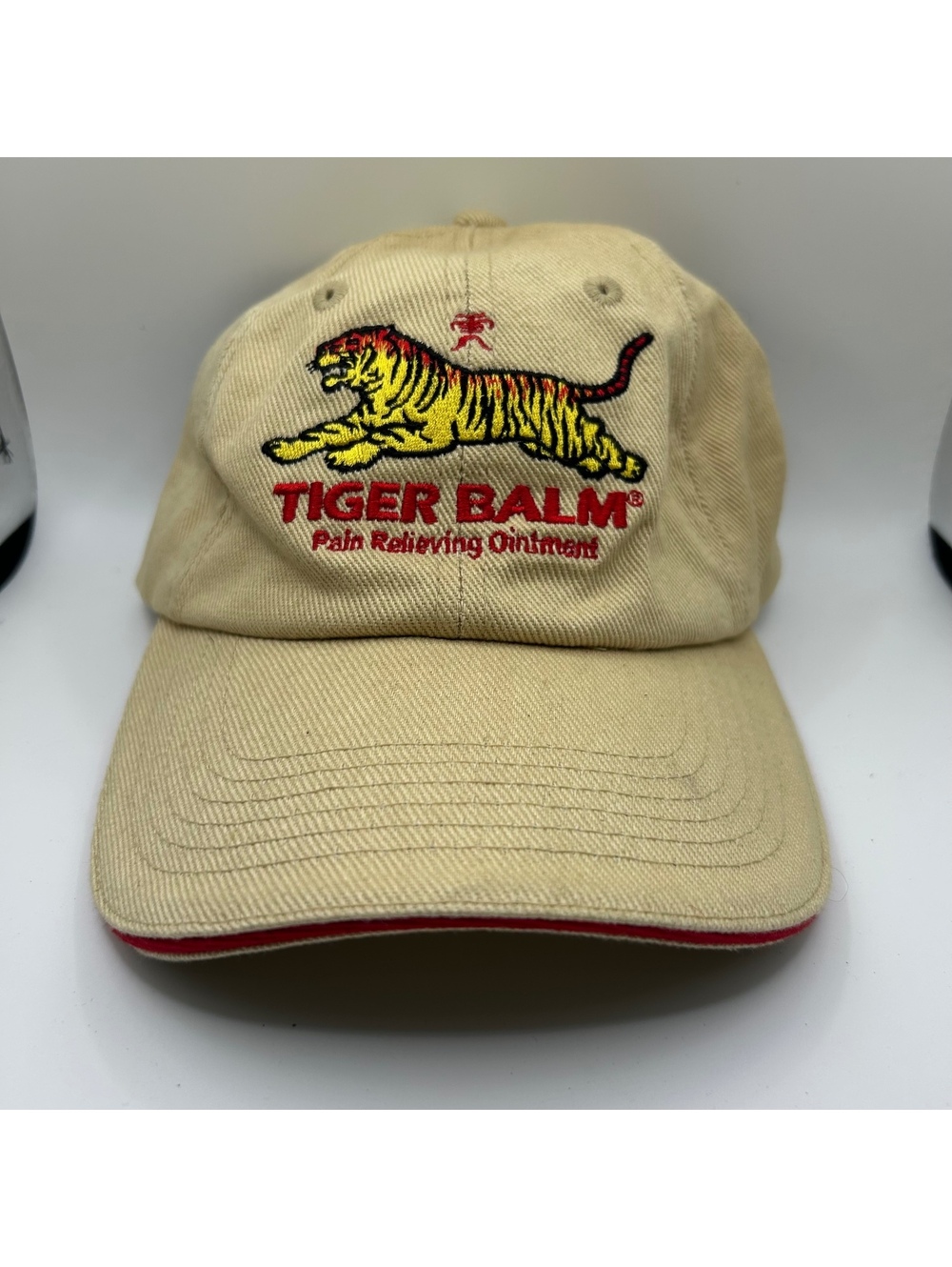 Tiger Balm beige cap